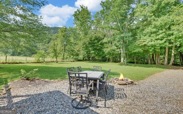 view of patio with an outdoor fire pit