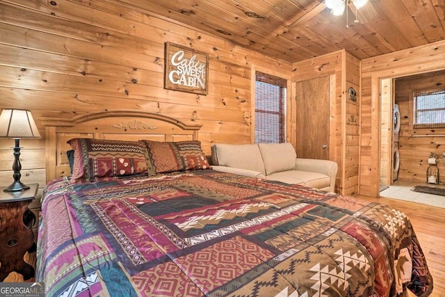 bedroom with wood walls, wood ceiling, and wood finished floors