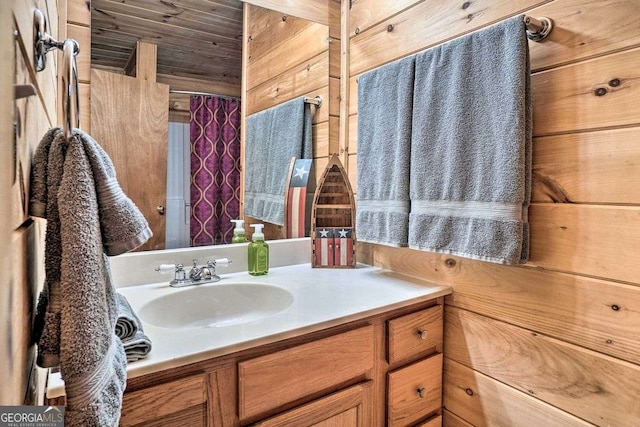 bathroom with vanity and wooden ceiling