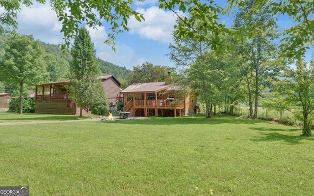 view of yard featuring a wooden deck