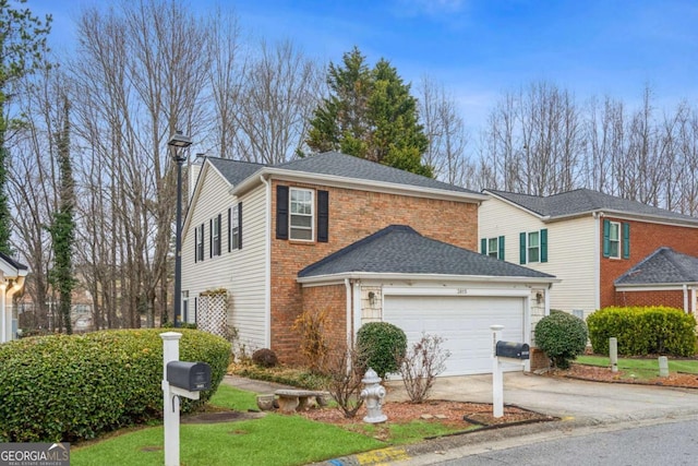 traditional-style home featuring driveway, a shingled roof, a garage, and brick siding