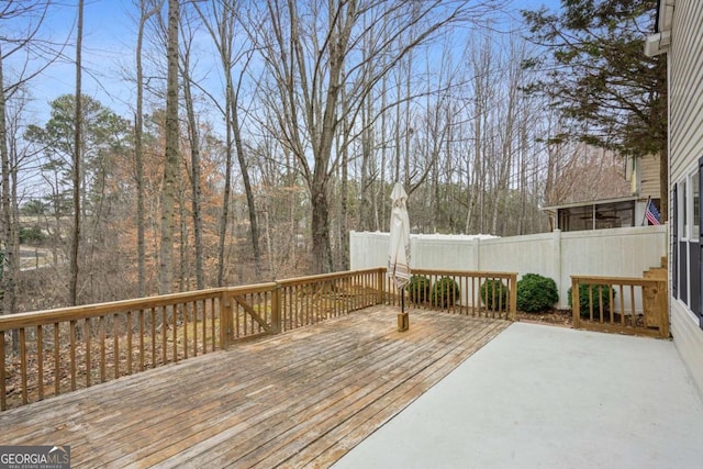 wooden deck featuring fence