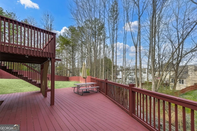 wooden terrace with a yard