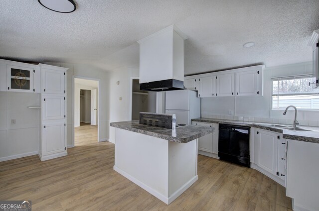 kitchen featuring a center island, dishwasher, white fridge, light hardwood / wood-style floors, and white cabinets