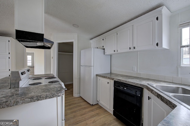 kitchen with white cabinetry, light wood-type flooring, a textured ceiling, and white appliances