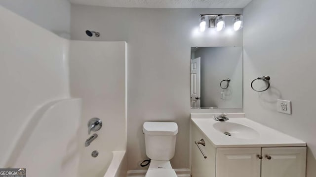 full bathroom featuring vanity, toilet, bathing tub / shower combination, and a textured ceiling