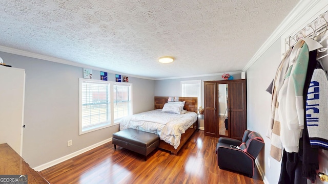 bedroom with crown molding, dark hardwood / wood-style floors, and a textured ceiling