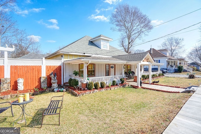 view of front of house with a front lawn and a porch