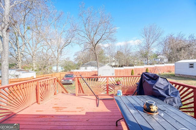 deck with a storage shed