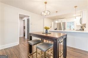 dining room featuring dark hardwood / wood-style floors