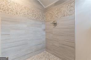 bathroom with a tile shower