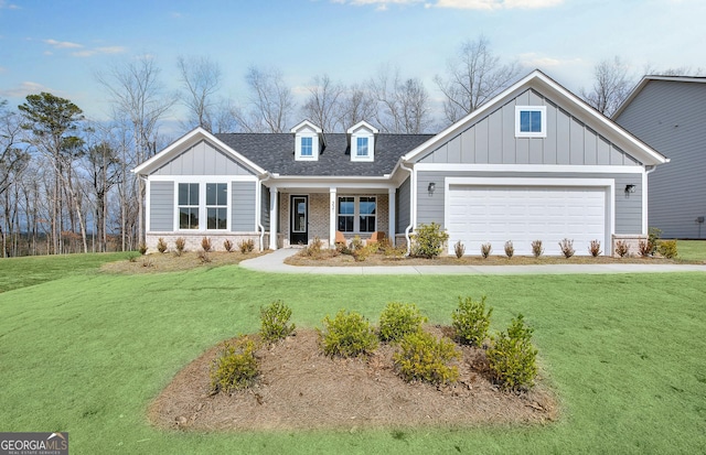 view of front of home with a porch, a garage, and a front yard