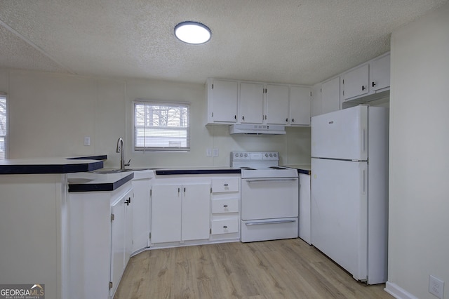 kitchen with sink, white cabinetry, a textured ceiling, white appliances, and light hardwood / wood-style floors