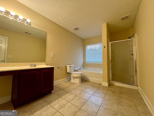 full bathroom with independent shower and bath, vanity, toilet, tile patterned floors, and a textured ceiling