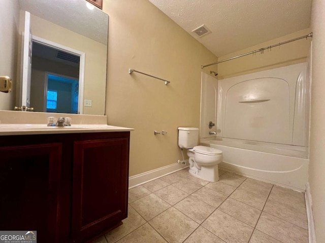 full bathroom featuring shower / washtub combination, vanity, a textured ceiling, tile patterned floors, and toilet