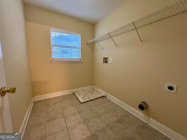 laundry area with gas dryer hookup, tile patterned floors, washer hookup, and electric dryer hookup