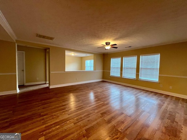 spare room featuring crown molding, hardwood / wood-style floors, a textured ceiling, and ceiling fan