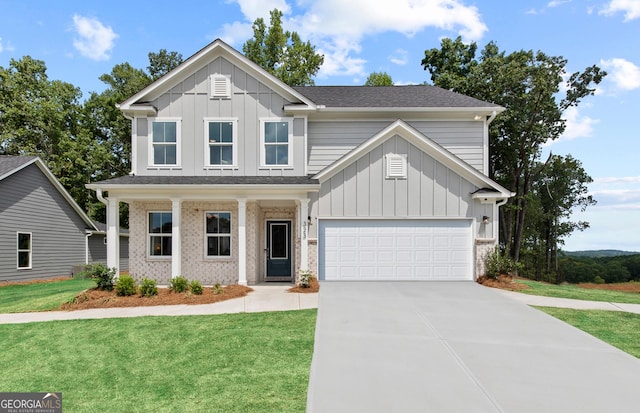 view of front of house with a garage and a front lawn