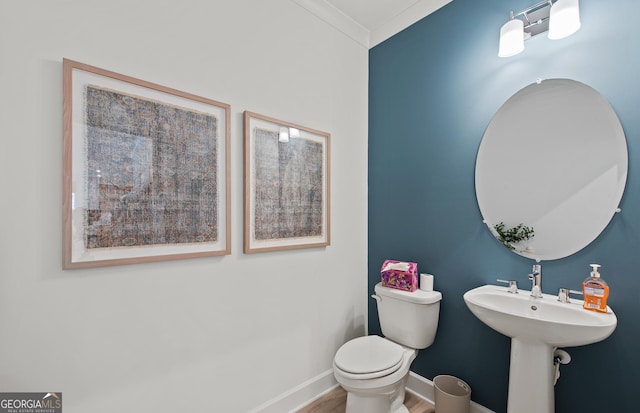 bathroom with hardwood / wood-style floors and toilet