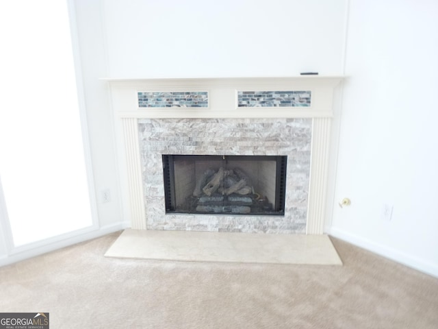 interior details with carpet and a fireplace