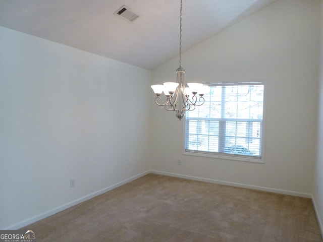 unfurnished room featuring lofted ceiling, baseboards, visible vents, and carpet flooring