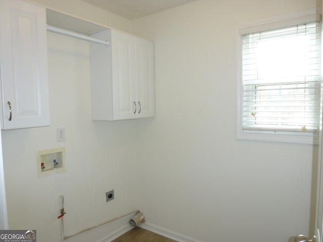 laundry area with cabinet space, baseboards, washer hookup, and hookup for an electric dryer