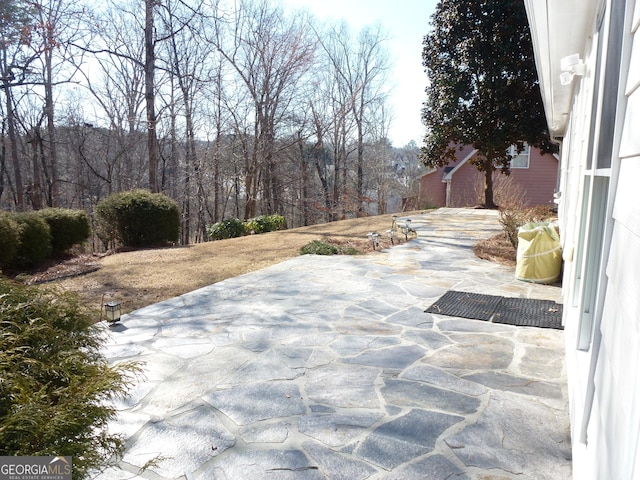 view of patio with a forest view