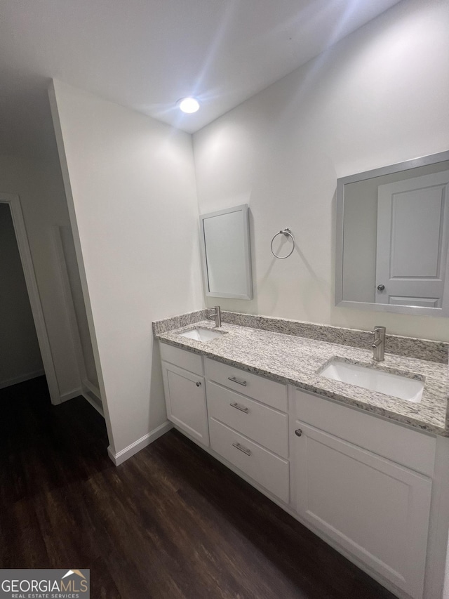 bathroom featuring vanity and hardwood / wood-style flooring