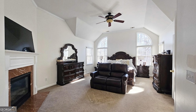 carpeted bedroom with ceiling fan, lofted ceiling, and a high end fireplace