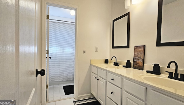 bathroom with vanity and tile patterned floors