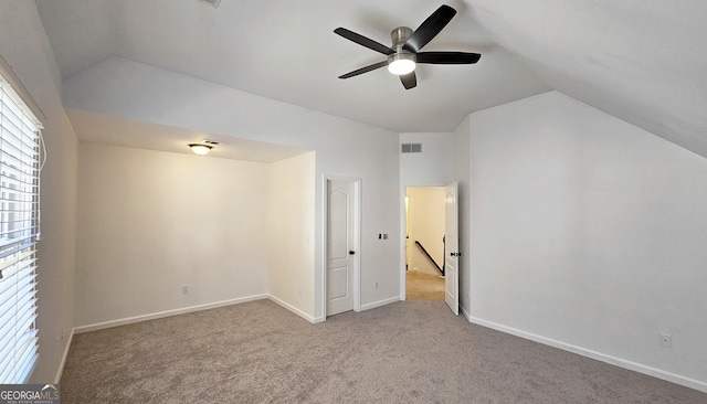 interior space featuring vaulted ceiling and ceiling fan