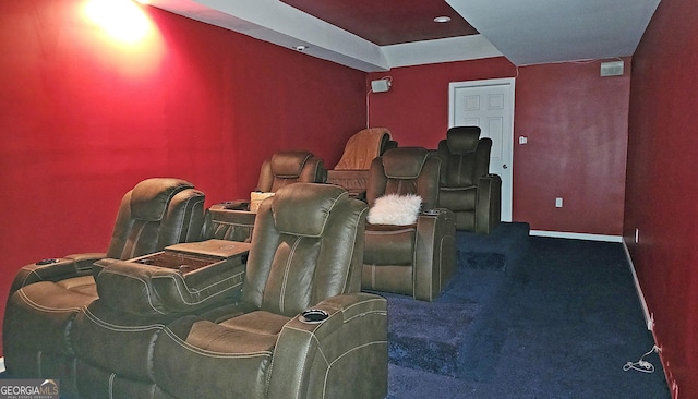 home theater room featuring dark carpet