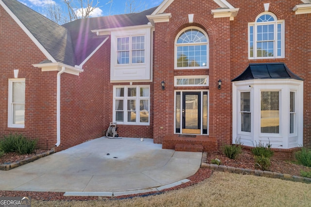 back of property featuring a patio area