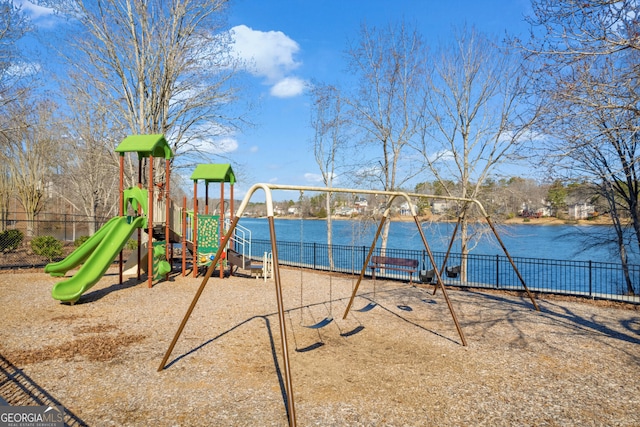 view of jungle gym featuring a water view