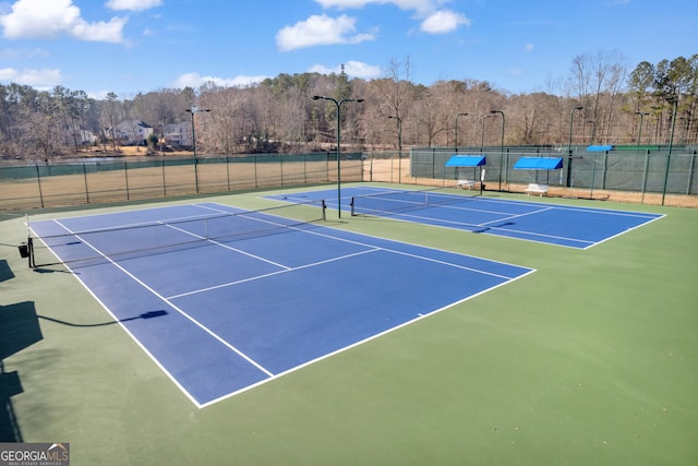 view of tennis court featuring basketball court