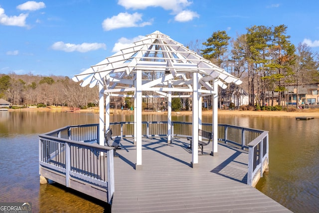 view of dock featuring a water view and a gazebo