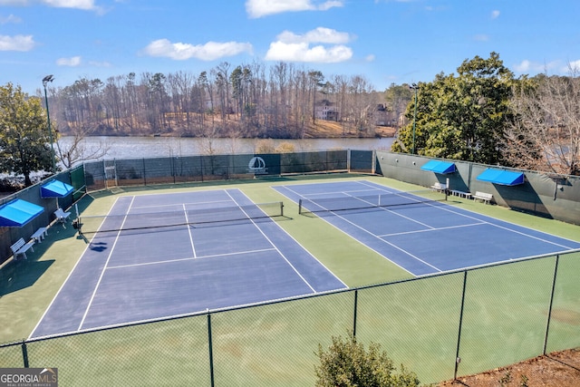 view of sport court featuring a water view