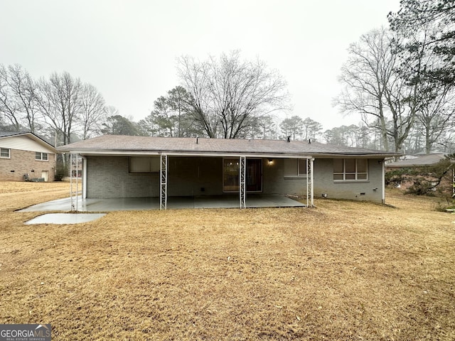 3403 Dodson Ter, East Point, GA 30344 - back of house featuring a patio and brick siding