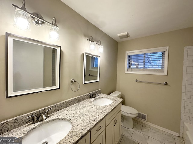 3403 Dodson Ter, East Point, GA 30344 - full bathroom with double vanity and marble look tiles