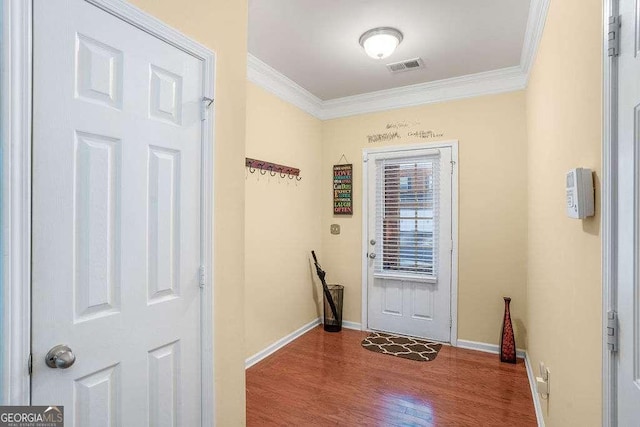 doorway to outside with crown molding and hardwood / wood-style flooring