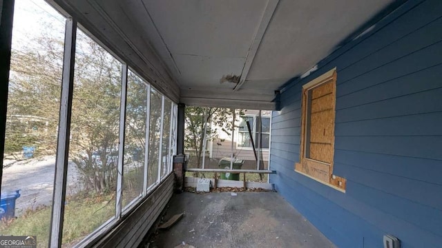 unfurnished sunroom with a wealth of natural light