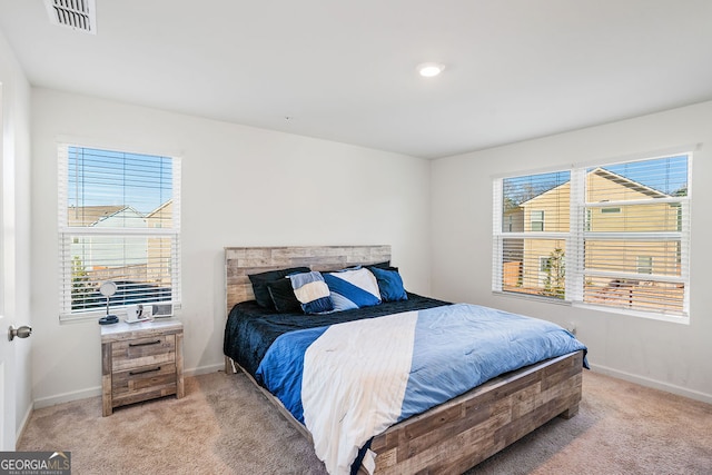 bedroom with light colored carpet