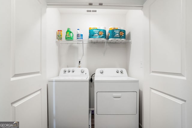 laundry area with separate washer and dryer