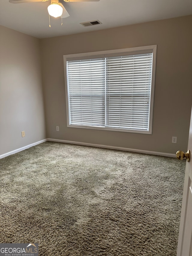 carpeted empty room with ceiling fan