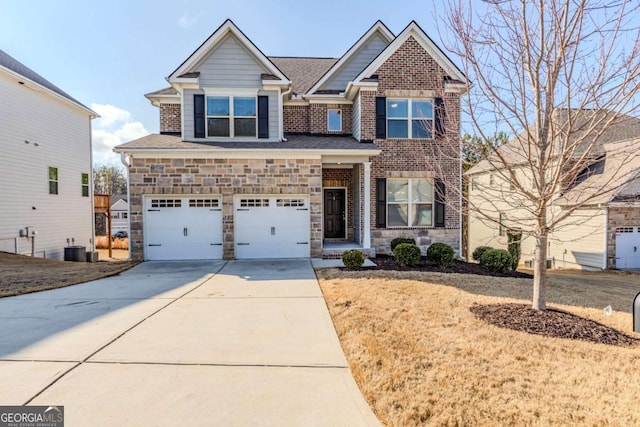 view of front of home featuring a garage and central air condition unit