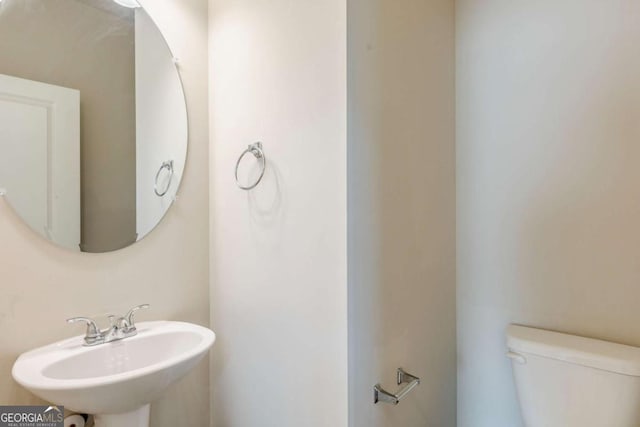 bathroom with toilet and sink