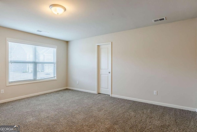 view of carpeted spare room