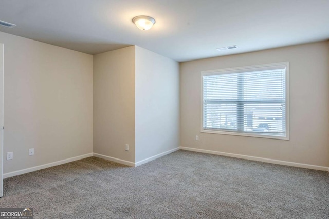 empty room featuring light colored carpet