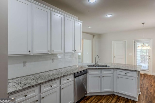 kitchen with sink, white cabinetry, dishwasher, kitchen peninsula, and pendant lighting