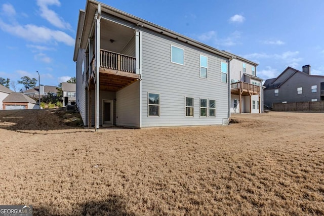 back of house with a balcony